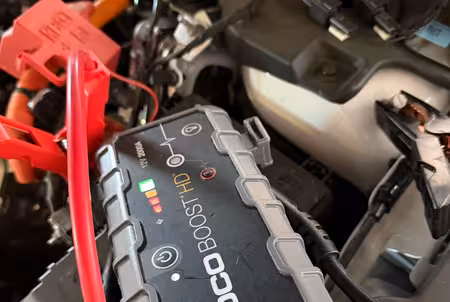 Jump starter connected to a car battery