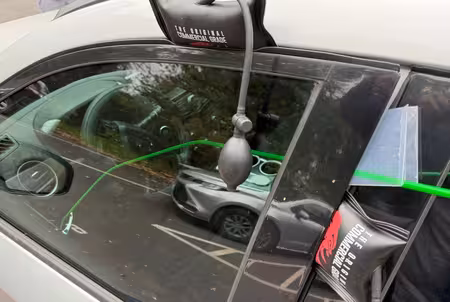 Air wedge and reach tool used for a damage-free vehicle lockout
